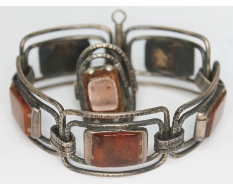 A Polish silver bracelet with amber slabs and matching ring.  