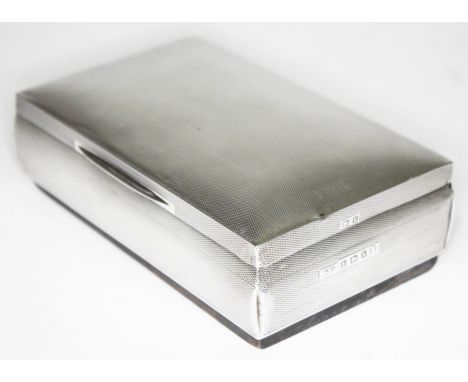 An Art Deco silver cigarette box, Hasset &amp; Harper Ltd, Birmingham 1934, length 15.5cm.  