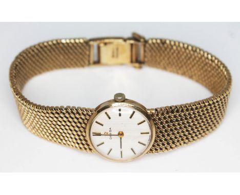 A 1969 hallmarked 9ct gold ladies Omega wristwatch and bracelet strap, ref 1061, with 17 jewel calibre 620 manual wind moveme