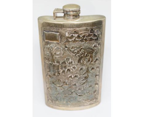 An eastern white metal hip flask, marked 'Silver', height 16.5cm.  