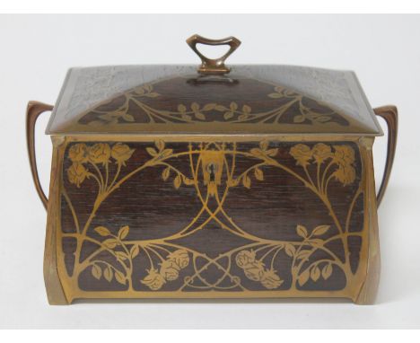 An Erhard &amp; Sohne Secessionist gilt brass inlaid rosewood jewellery casket having domed top, stylised finial and twin han