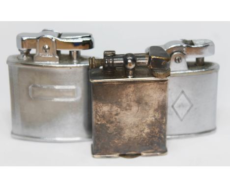 A Parker Beacon silver plated lighter and two others.  