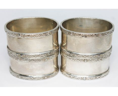 A set of four silver serviette rings, Joseph Gloster, Birmingham 1973, wt. 5oz.  