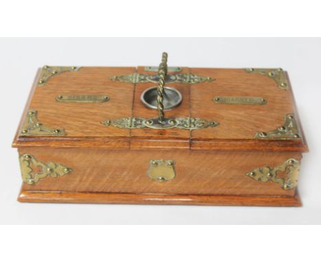 A Victorian brass mounted oak cigar and cigarette box with cedar lined interior, length 30.5cm.  Condition - later alteration