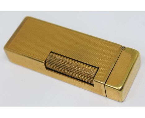 A vintage gold plated Dunhill lighter.  