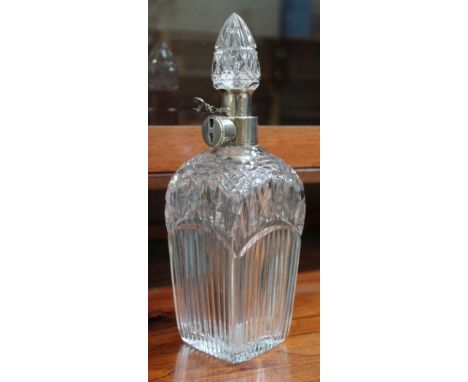 A George V cut glass decanter with lockable hallmarked silver collar, Hukin &amp; Heath, Birmingham 1925, height 27cm.  Condi