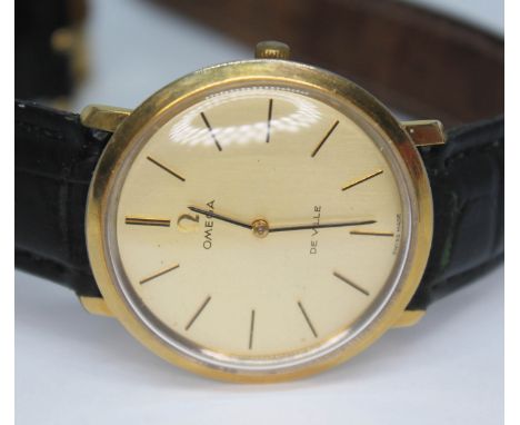A 1968 Omega De Ville 111.077 gold plated wristwatch with signed gold coloured dial, black baton hands and hour markers, stai