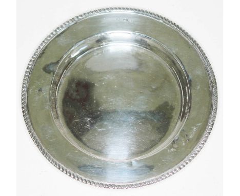 A hallmarked silver dish with gadrooned rim, diam. 16.5cm, wt. 4oz.  