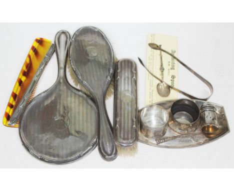 A mixed lot of hallmarked silver comprising a dressing table set, a serviette ring, a pin dish, Georgian sugar tongs etc.  