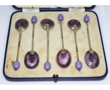 A cased matched set of six Art Deco silver and enamel bean spoons, five teaspoons hallmarked: Turner and Simpson, Birmingham 