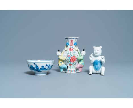 Full title:  A Chinese blue and white bowl, a figure of a boy and a famille rose wall vase, Kangxi/QianlongDescription: H.: 1