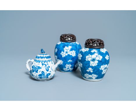 Full title:  A pair of Chinese blue and white 'prunus on cracked ice' jars and a 'butterfly' teapot and cover, KangxiDescript