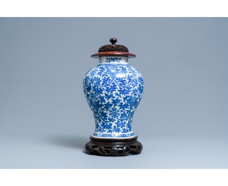 Full title:  A Chinese blue and white 'lotus scroll' vase, 19th C.Description: H.: 48 cm (the whole) H.: 34 cm (the vase)Plea