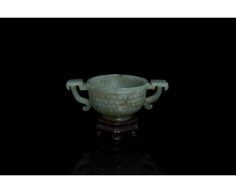 Full title:  A Chinese jade two-handled libation cup, MingDescription: L.: 12,5 cm - H.: 5 cm (the cup)L.: 12,5 cm - H.: 7 cm