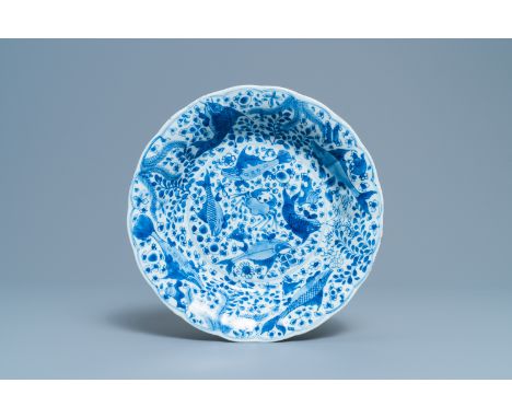 Full title:  A Chinese blue and white lobed dish with fish, KangxiDescription: Dia.: 27 cmÊ Condition: (UV-checked)- In very 