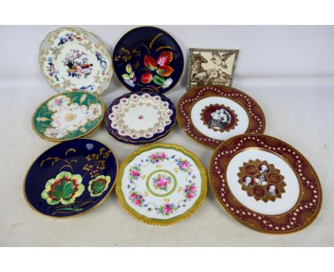 A collection of cabinet plates to include a Copeland Spode example decorated with roses and butterflies, a pair of Cauldons p