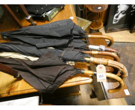 A group of 6 vintage gentlemen's umbrellas to include shooting stick topped example 