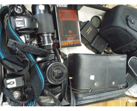 Box containing cameras camera cases, camera lenses etc 