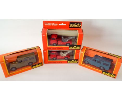 Four Solido models Land Rovers and breakdown trucks mint and boxed 