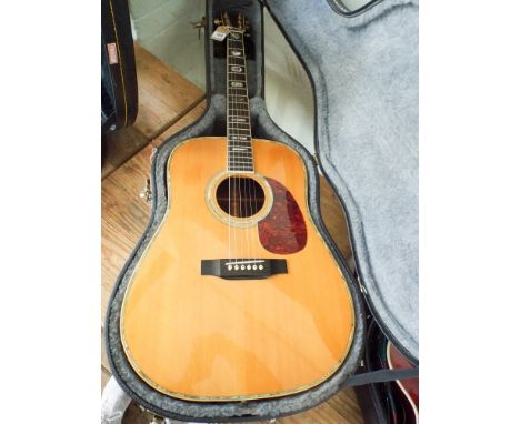 Acoustic six string sigma guitar in its black fitted case Model number 94070616  Small bruise on body