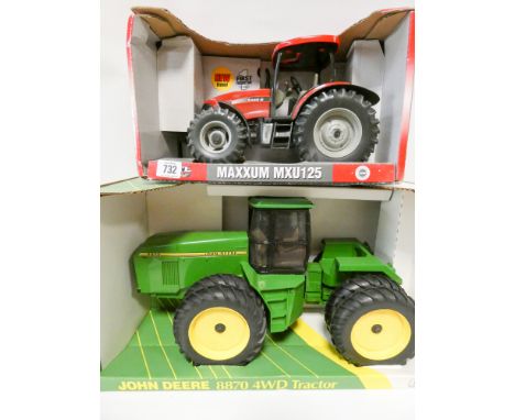 ERTL John Deere four wheel drive tractor, boxed, and a cased MXU125 tractor, boxed