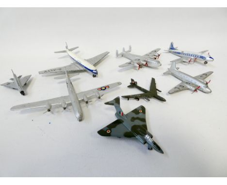 Collection of eight Dinky toy vintage aeroplanes, Comet 702, Boeing B50, York 704 etc. Played with condition 