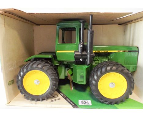 An ERTL John Deere four wheel drive tractor mint and boxed 