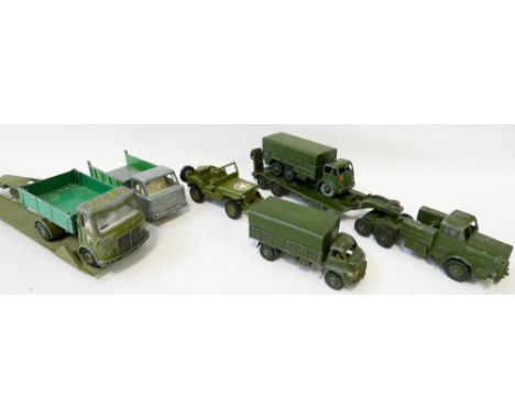 Collection of eight vintage Dinky military army trucks and transporters, played with condition 