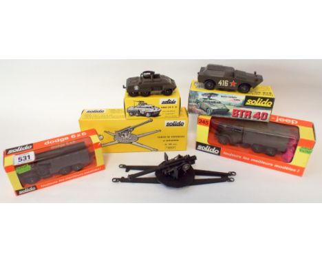 A collection of five Solido metal die-cast military toys, jeeps, tanks and armored cars 