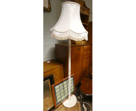A cream standard lamp with shade 