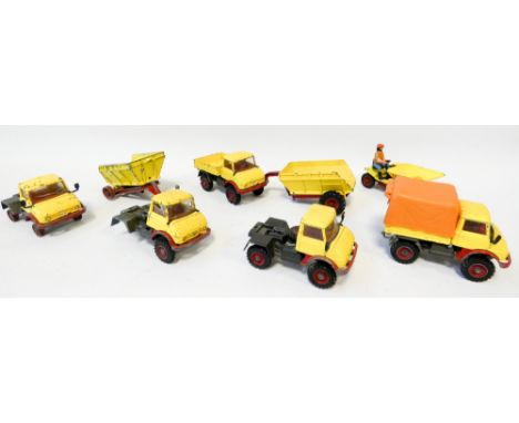 Collection of eight vintage Corgi builder trucks and lorries, dump trucks etc. Played with condition 