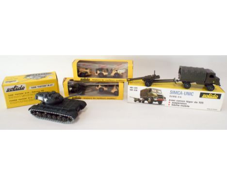 A collection of four Solido vintage boxed military toys to include tanks and cannon trucks 