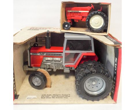 1:20 scale replica Massey Ferguson tractor and 1:32 scale international mini tractor, both by ERTL, both boxed