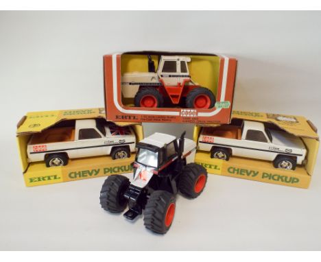 Three ERTL boxed die-cast toys, Case 4 wheel drive tractor, 2 Chevy pick ups and a tractor 4894 without box 
