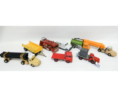 Collection of eight vintage Dinky toys, played with condition, to include Supertoys tractor units with pipes etc 