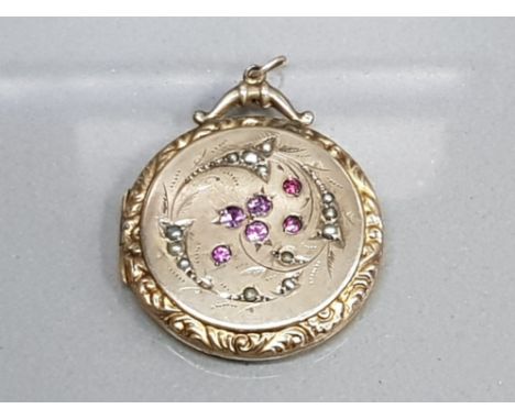 GOLD PLATED ORNATE LOCKET WITH PEARL AND RUBY STONES SET ON THE FRONT OF THE LOCKET WITH SCROLL EDGE 8.8G GROSS