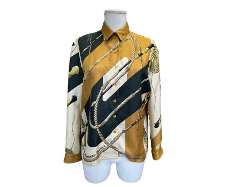 HERMES Paris. Chemisier 'Fouets'En soie imprimée.Taille française: 40Condition d'état: B-Footnotes:A printed silk blouseCondi