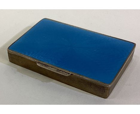 A silver plated and blue enamelled snuff box with hinged lid. Est. £20 - £30.