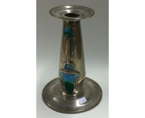 A stylish silver and enamelled candlestick. London. By SH. Approx. 273 grams of gross weight. Est. £30 - £50.