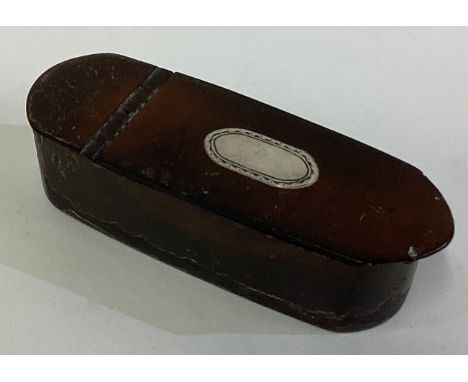 A 19th Century silver mounted snuff box with hinged lid. Est. £30 - £40.