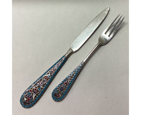 A Russian silver and enamelled knife and fork set. Circa 1900. Approx. 54 grams. Est. £200 - £300.