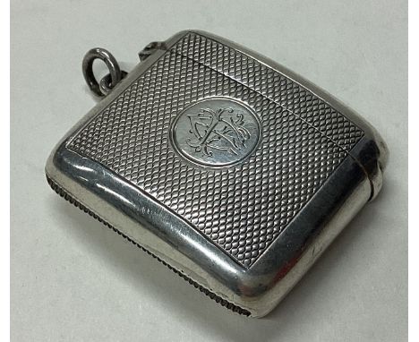 A large Victorian silver vesta case with engine turned decoration. 1899. By A&J Zimmerman. Approx. 41 grams. Est. £40 - £60.