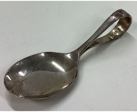 A silver caddy spoon. Birmingham 1960. Est. £10 - £20.