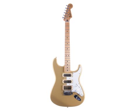 Custom build Strat style electric guitar comprising a 2012 Fender Mexican Stratocaster neck, metallic gold finish Strat style