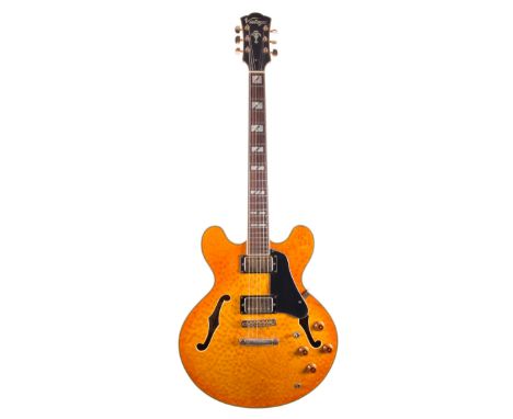 Vintage VSA-65 hollow body electric guitar, made in Korea; Finish: figured amber, mild imperfections; Fretboard: rosewood; Fr