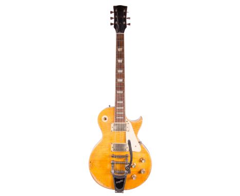 Les Paul style electric guitar, probably an over distressed Vintage Lemon Drop; Electrics: working; Case: distressed hard cas