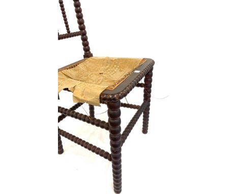 Mahogany bobbin and wicker bedroom chair in need of restoration 