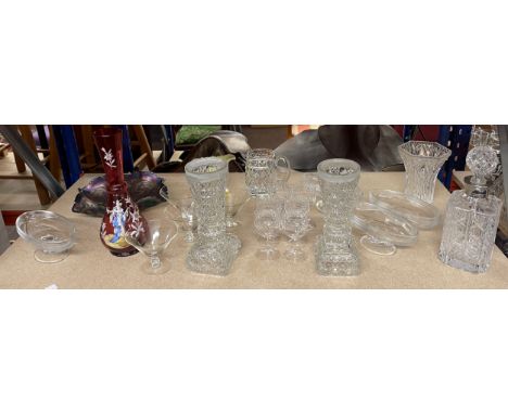 Shelf of assorted glassware to include coloured glass, carnival ware, decanters etc 