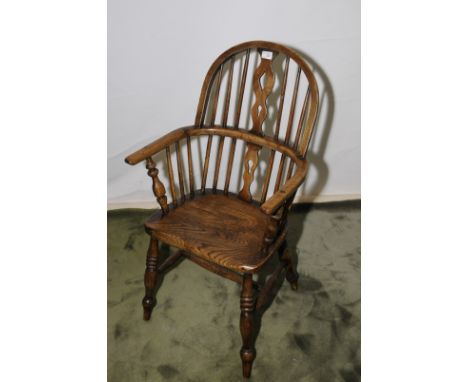 Stick back elm Windsor armchair with H shaped under stretcher and turned supports 