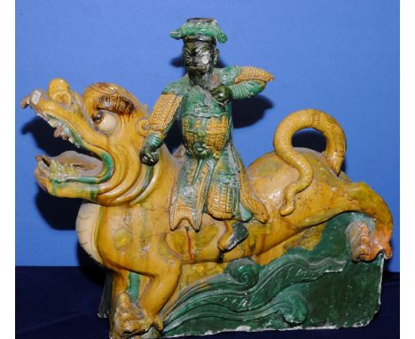 Pair of 18th/19th century glazed ceramic Chinese roof ridge tiles in the form of warriors riding dragons (60cm high)